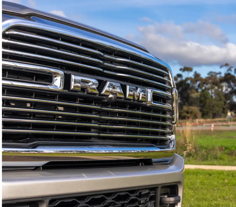 The grille of the RAM 1500 Big Horn featuring the RAM logo